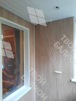 Отделка балкона под ключ ламинатом и натяжным потолком