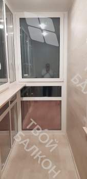 Панорамное остекление с тонировкой и отделка балкона