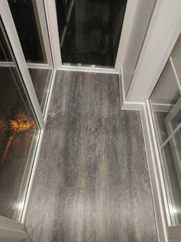 Панорамное остекление и отделка п-образного балкона с утеплением