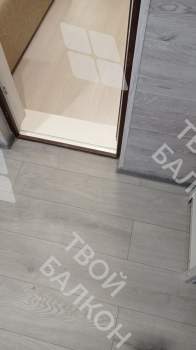 Отделка балкона с установкой теплого пола и остекление Rehau 70